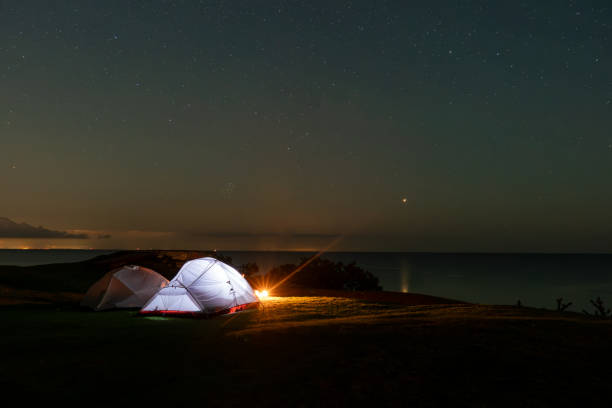 istock Lights in tent camping at night 1654912341