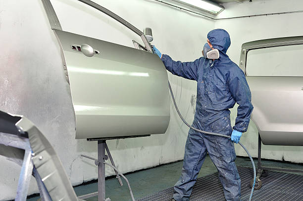 istock Worker painting car door. 165492951