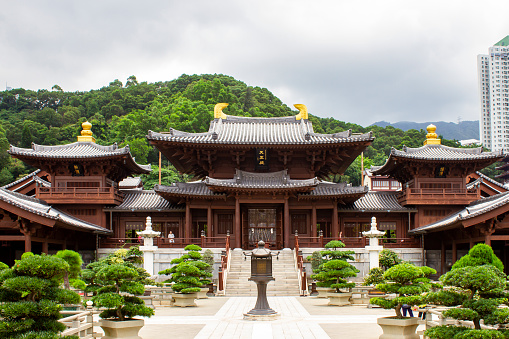 Asian woman praying in temple