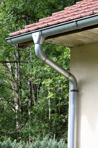 istock Red roof with aluminum gutter and drain pipe 165494050