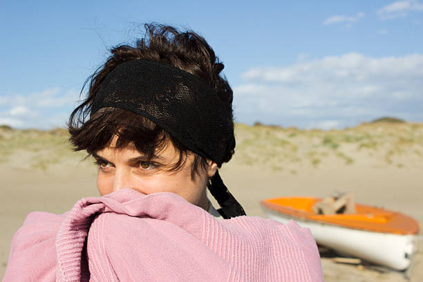 Woman on the beach stock photo