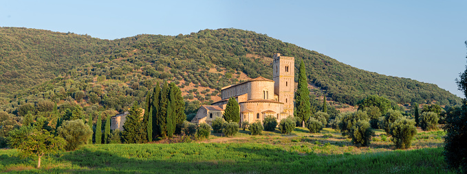 Montalcino, Tuscany: panorama of the ancient abbey of Sant' Antimo. View banners.