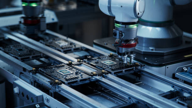 istock Component Installation and Quality Control of Black Circuit Board. Fully Automated PCB Assembly Line Equipped with High Precision Robot Arms at a Factory. Electronic Devices Manufacturing Industry 1654943665