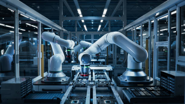 istock Manufacturing Automation. Advanced High Precision Robot Arms on Automated PCB Assembly Line Inside Modern Electronics Factory. Electronic Devices Production Industry. Component Installation Process. 1654943969