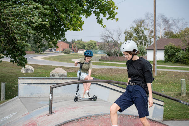 istock Sibling Adventure: Ready to Drop-In at the Skate Park Ramp 1654949527