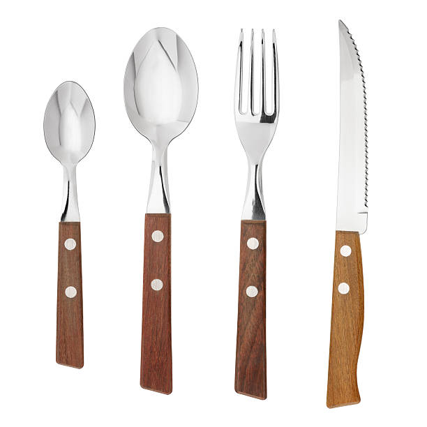 Utensil assortment of two spoons, a fork and a knife Set of cutlery handle stock pictures, royalty-free photos & images