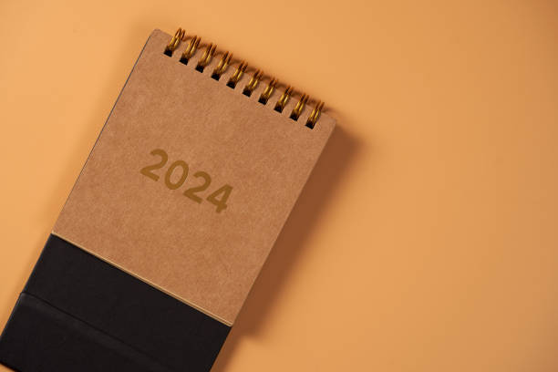 istock desk calendar year 2024 against orange background 1654954854