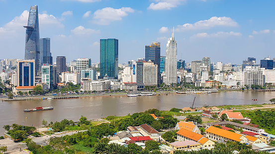 Ho Chi Minh City, Vietnam - February 9, 2023 : Aerial View Of Ho Chi Minh City Skyline With Buildings In Central And The Congregation Of The Lovers Of The Holy Cross Thu Thiem On River Side.