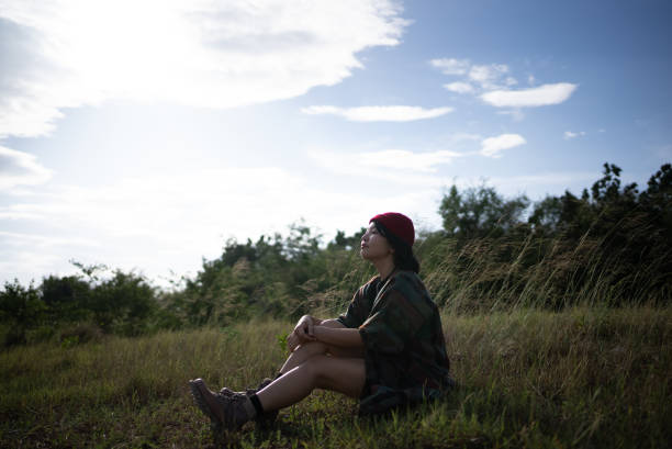 Woman surrounded by nature. Soak up the serene atmosphere and the stunning scenery. Beautiful girl deeply breathing , enjoying relaxation. ,lifestyle concept ,People, lifestyle concept , looking happy , Nature, outdoors