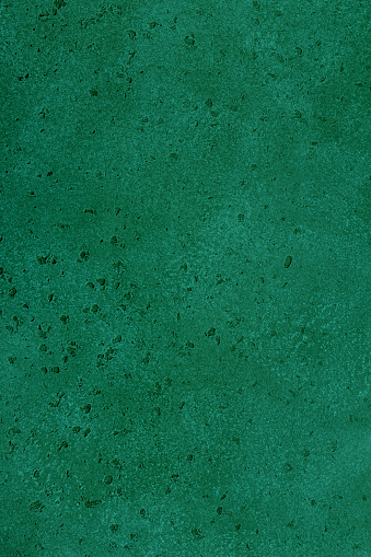 Green emerald stone background, wall or floor. Abstract texture for graphic design or wallpaper.