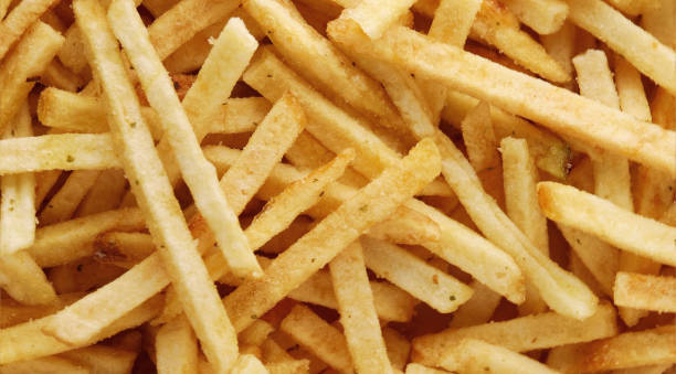 istock potato straws. potato background Macro. Falling potatoes, fries 1655071447