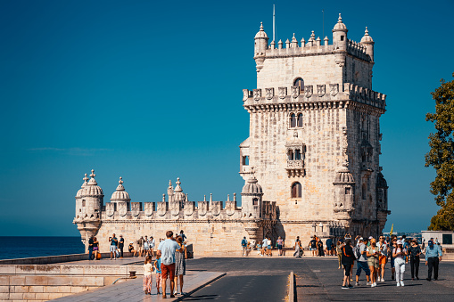 Lisbon, Portugal- Aug 18, 2023: Tourists visiting the historic Belém Tower in Lisbon, Portugal