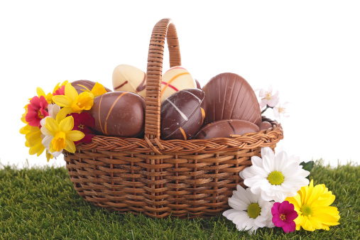 easter egg in wicker basket with flower