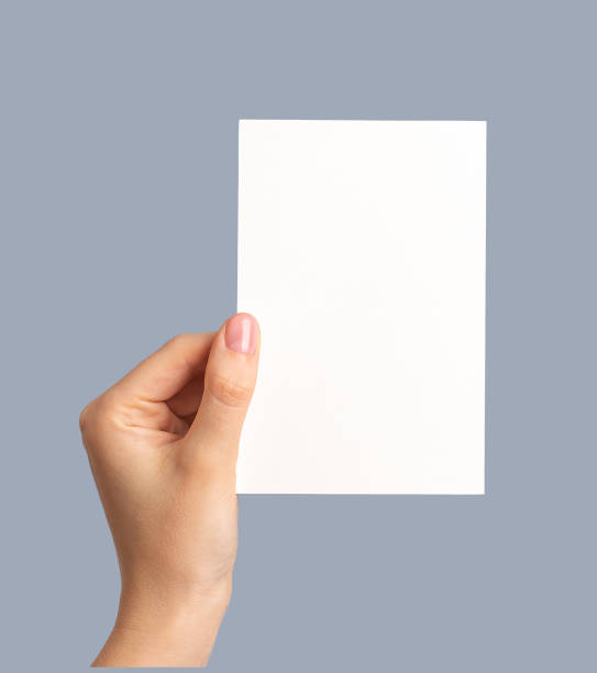 Hand holding greeting holiday card mock up, blank empty postcard