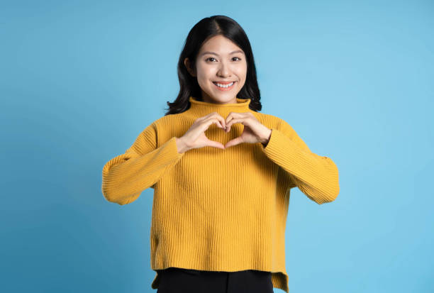 istock image of young asian girl posing on a blue background 1655093716