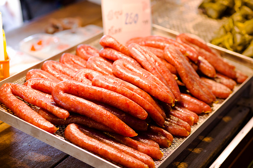 Thai pork sausages on market in Amphawa