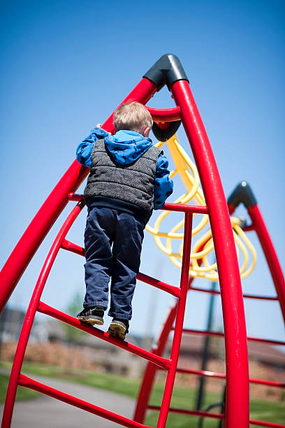 istock Young Boy Plays at Outdoor Playground 165510145