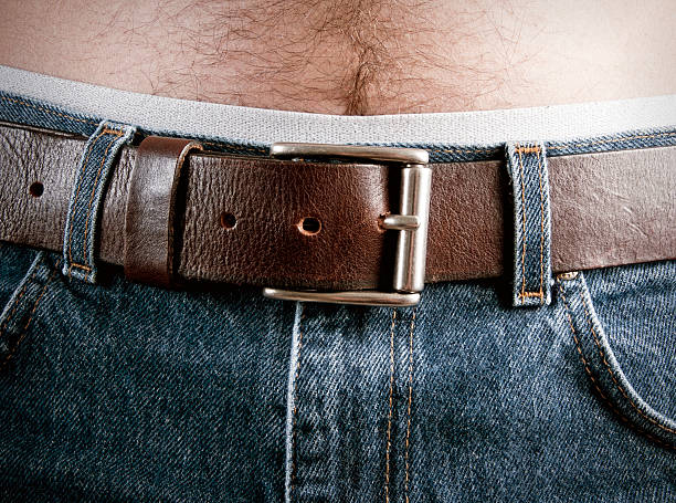 istock Man's Abdomen in Blue Jeans 165510996