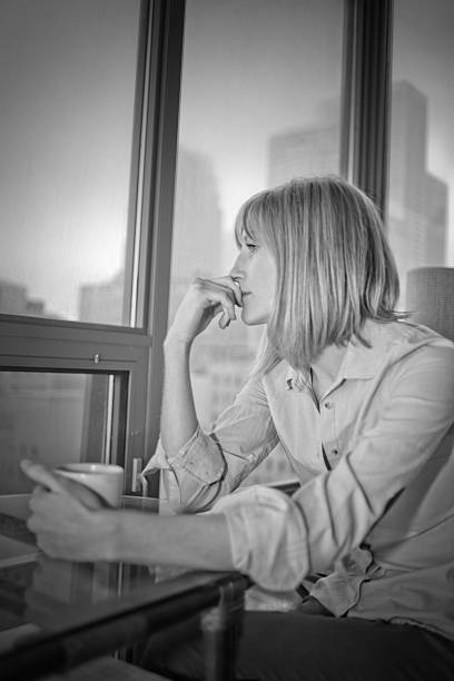 istock Beautiful Real Woman Thinking in Condo 165511036