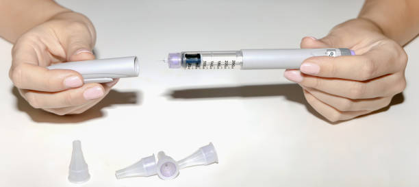 istock Woman holding an injection pen for diabetic. 1655115831