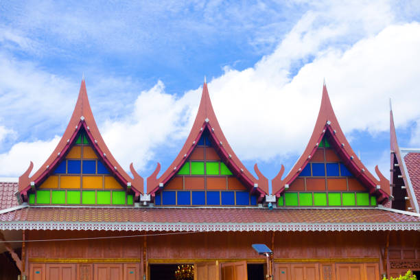 Three gables of wooden historical thai building Three gables of wooden historical thai building at river Mae Khlong in Amphawa true thailand classic stock pictures, royalty-free photos & images