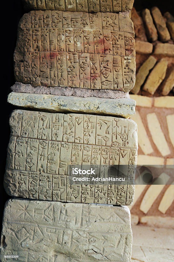 Ancient Sumerian writing Natural stones with ancient cuneiform Sumerian writing. Cuneiform Stock Photo