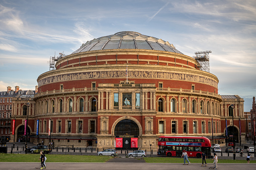 London, UK: The Royal Albert Hall, a famous concert hall and performance venue in South Kensington, London. Evening view from Kensington Gardens.
