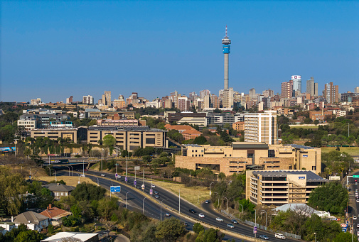 Johannesburg city panorama with the M2 motorway that surrounds the city centre, the communication tower is seen on the right. Johannesburg is also known as Jozi, Jo'burg or eGoli and is the largest city in Southern Africa.