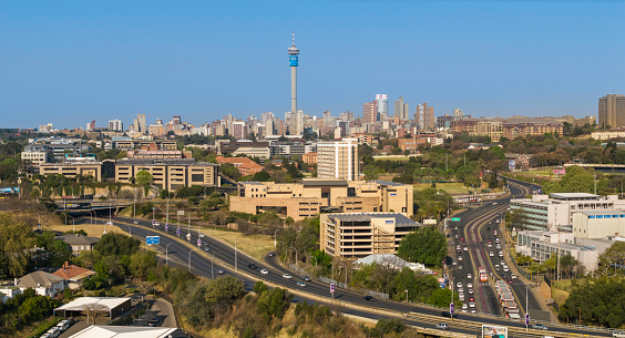 Johannesburg city panorama with the M2 motorway that surrounds the city centre, and Empire st, leading into the city on the right, the communication tower is seen in the centre. Johannesburg is also known as Jozi, Jo'burg or eGoli and is the largest city in Southern Africa.