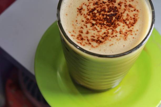 istock Hot cappuccino with topping on it and placed on white table 1655170797