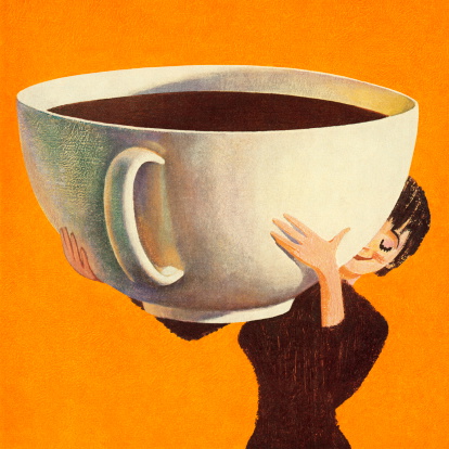istock Woman Holding a Huge Cup of Coffee 165517310
