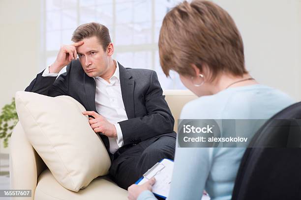 Depressed Man Talking With Psychologist Stock Photo - Download Image Now - Addiction, Adult, Alcohol Abuse