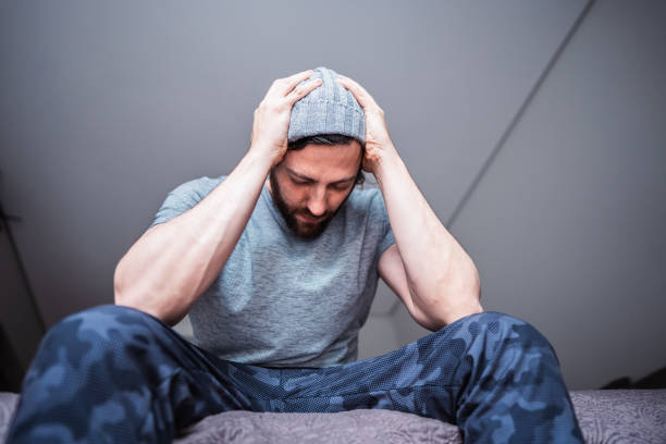 Depressed mid adult man at home