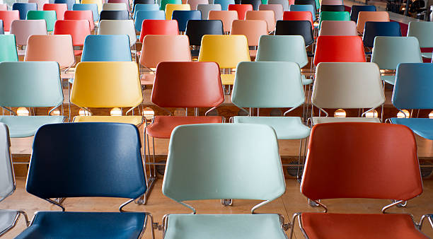 colorful empty chairs in theater stock photo