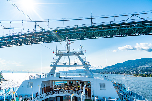 Vancouver, British Columbia - July 25, 2023: White antennas and Lions Gate Bridge, Vancouver, Canada.