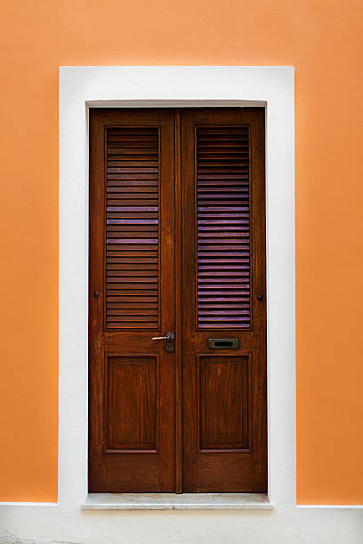 beautiful colorful colonial decorated wooden historic door building entrance in downtown old san juan puerto rico travel tourism destination caribbean island