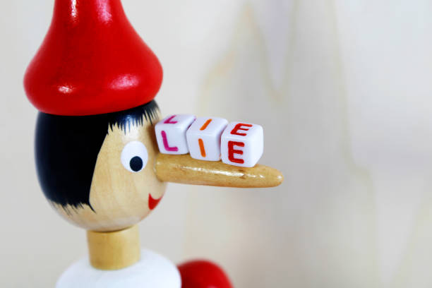 istock Pinocchio lie, wooden jointed doll 1655272209