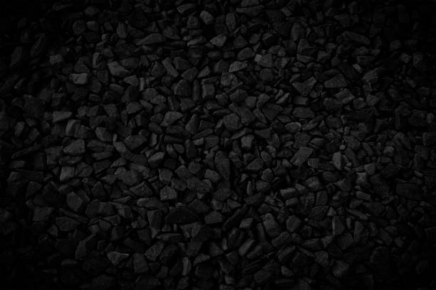 istock Black small rocks ground texture. black small road stone background. gravel pebbles stone seamless texture. dark black background of crushed granite gravel, close up. clumping clay 1655295805