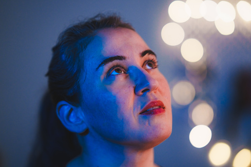 Portrait of a woman at with night light bokeh