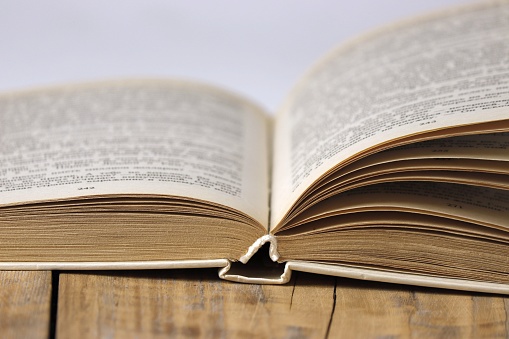 Close-up of an open book on the table.