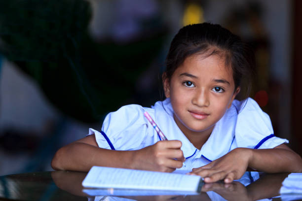 istock Studying hard - school girl in Cambodia 165531966