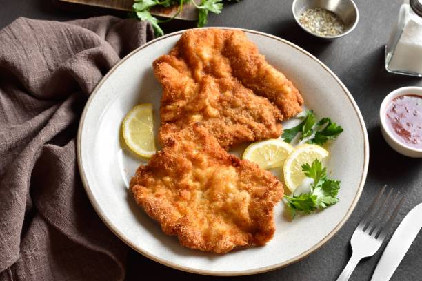 istock Schnitzel with lemon and leaves of parsley 1655319892