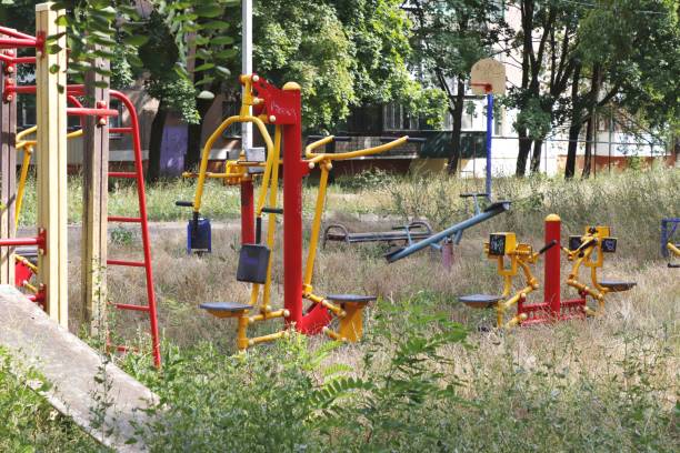 istock Depicted is an abandoned, overgrown sports ground with various simulators for training the body and muscles. 1655350372