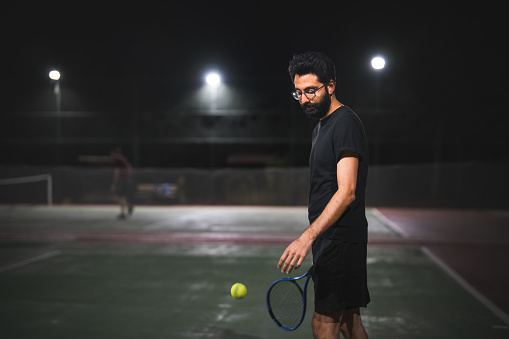 Playing tennis at night