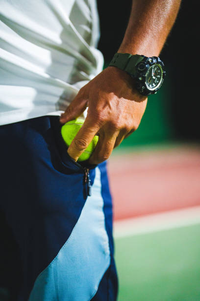 istock Man taking out a tennis ball from his pocket 1655380635