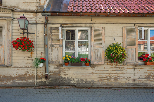 Wooden House Facade with flowers - Cesis, Latvia