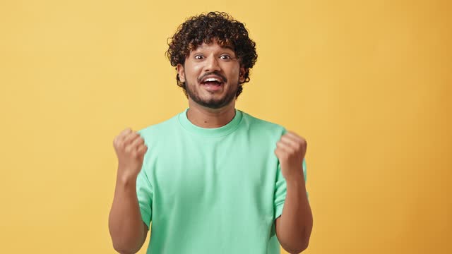 A man on a yellow background.