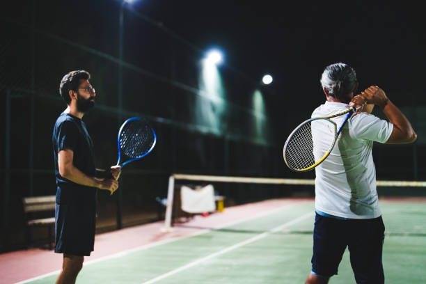 istock Adult Tennis Lessons at Night 1655398230