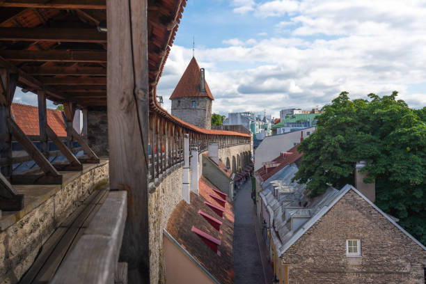 Helleman Tower and Tallinn City Walls - Tallinn, Estonia Helleman Tower and Tallinn City Walls - Tallinn, Estonia town wall tallinn stock pictures, royalty-free photos & images