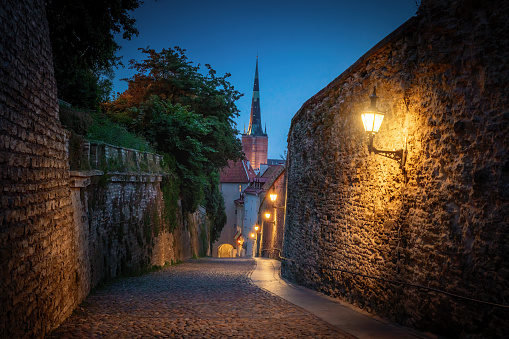 Long Leg Gate Tower and St. Olaf church at night - Tallinn, Estonia